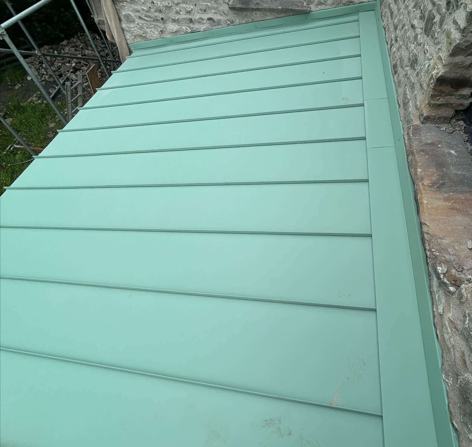 Silver fir green standing seam roof installation